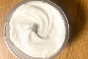 Whipped tallow face lotion in jar.