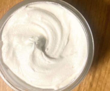 Whipped tallow face lotion in jar.