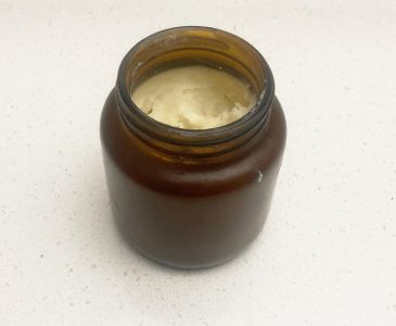DIY hair styling cream in an amber colored jar