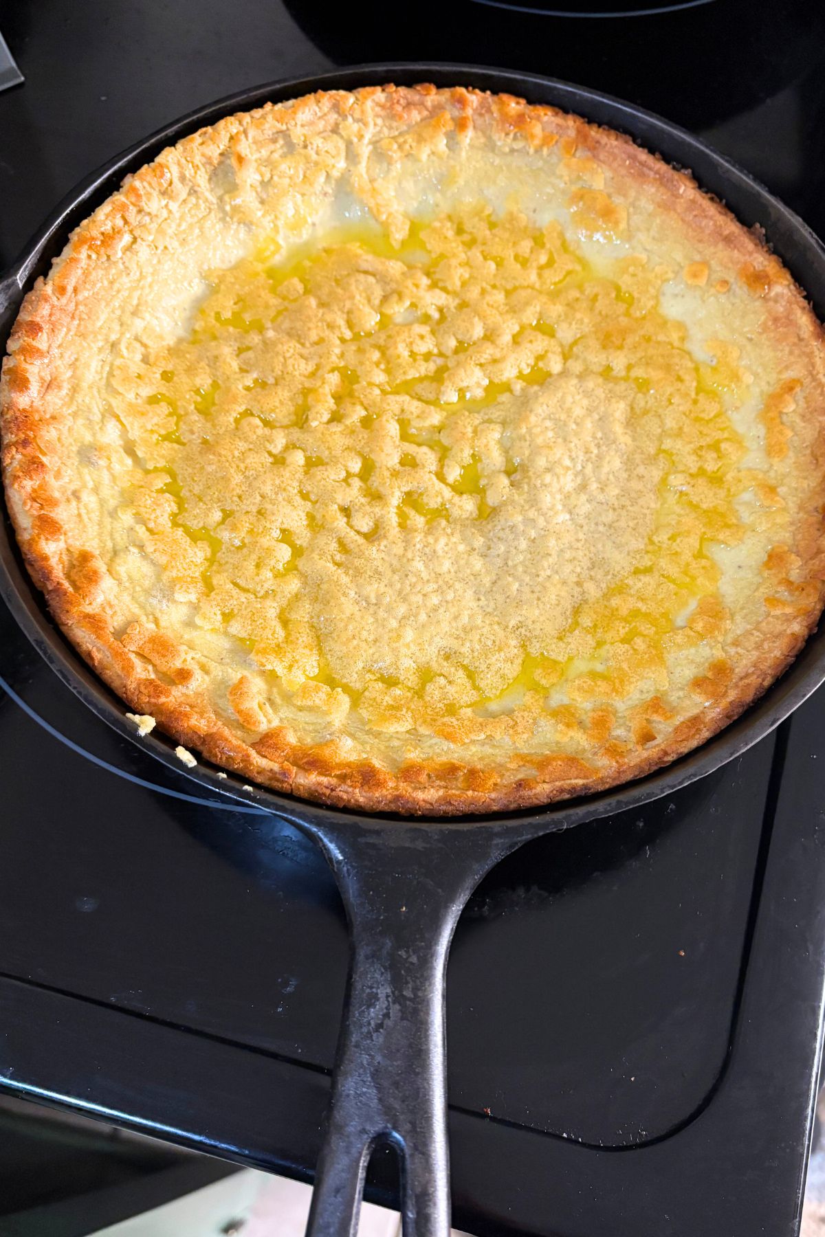 fresh milled gluten free flour sourdough oven pancake in a cast iron skillet