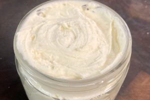 DIY whipped tallow body butter lotion in a glass jar