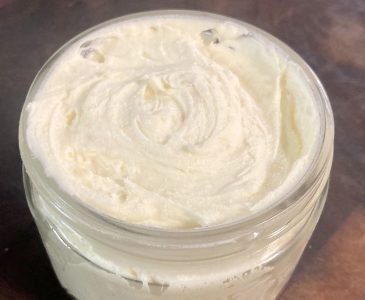 DIY whipped tallow body butter lotion in a glass jar