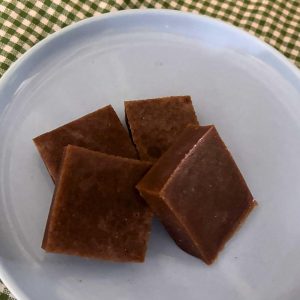homemade grape gummy candies on light blue plate